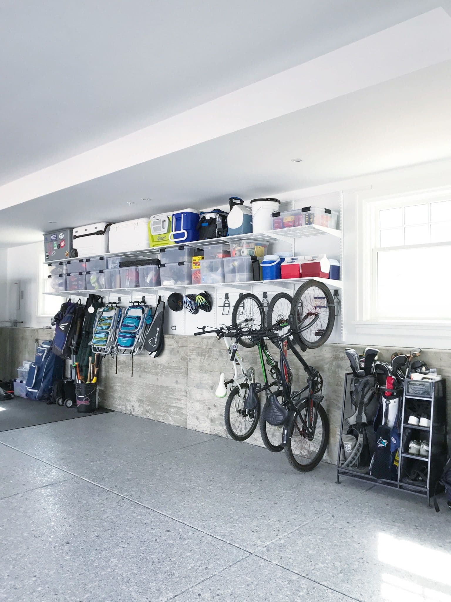 Organized garage with overhead shelving and storage